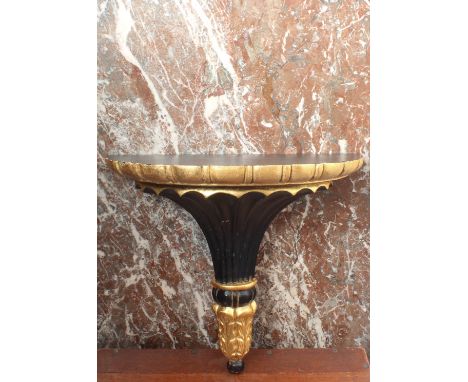 An Italian 18th century style carved wooden, ebonised and parcel gilt wall bracket - second half 20th century, the demi-lune 