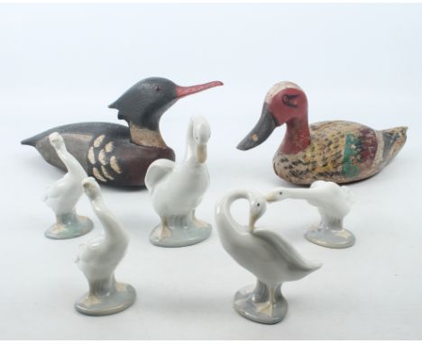 Five Lladro and Nao ducks and two wooden wildfowl decoys - the four Lladro ducks and single Nao duch all with printed factory