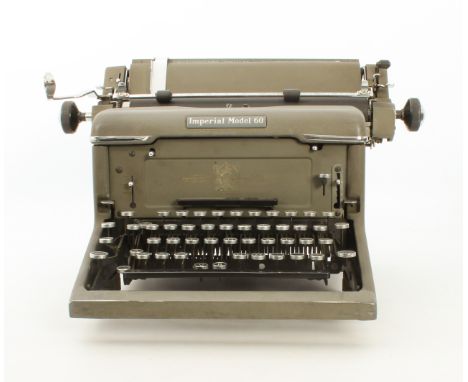 A vintage Imperial Model 60 typewriter, early 20th century - with rexine dust cover.