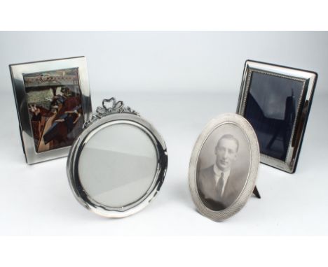 Four silver photo frames - comprising two modern rectangular sterling silver frames with easel backs, Carrs of Sheffield 2000
