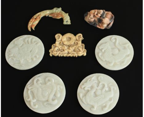 Six Chinese carved jade discs and plaques - 20th century, including four white jade discs carved with archaistic beasts (drag
