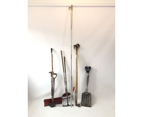 A collection of garden tools - including a long reach pruner; a stainless steel spade and fork; hoes; long-handled wire brush