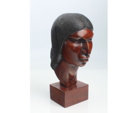 An Art Deco style carved wooden bust of a South American woman - on a plinth base, 27cm high overall.