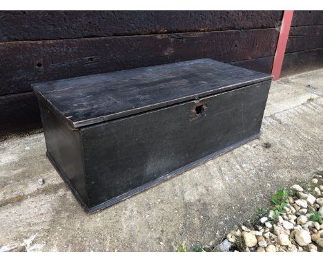 A vintage black painted pine trunk with candle box - (LWH 112 x 50 x 38cm)