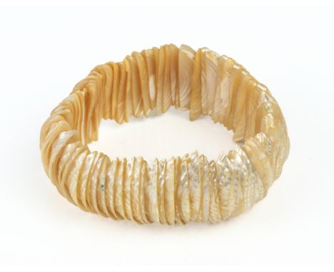 A vintage mother of pearl elasticated bangle - probably 1960s.
