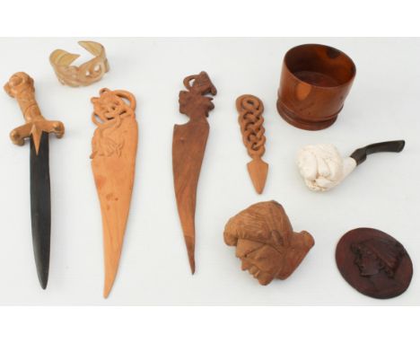 A mixed lot of mostly treen: four carved wood letter-openers; a small carved cameo (7 cm diam.); a horn bangle; a turned yew 