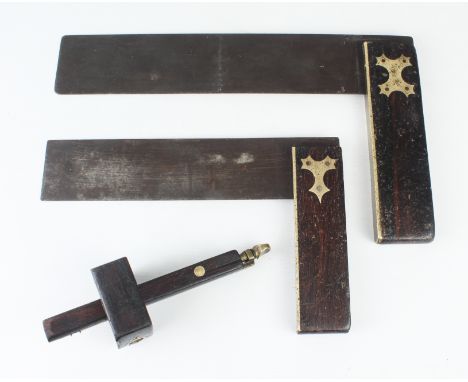 Three antique ebony and brass woodworking tools - comprising a marking gauge and two carpenters squares, the larger 36cm long