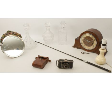 A mixed lot of eight : - three cut glass decanters; - a 1930s-40s walnut Art Deco style quarter striking and chiming mantel c