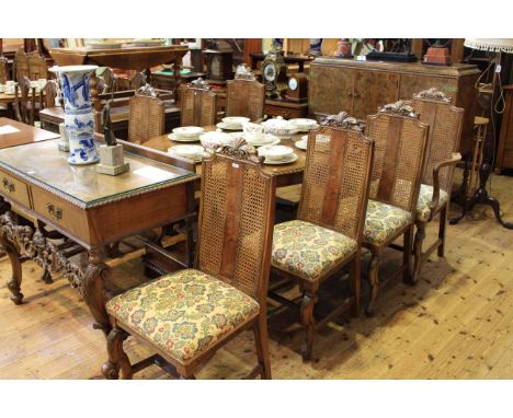Early 20th Century walnut eleven piece dining suite in Carolean style comprising three door buffet sideboard, two drawer serv