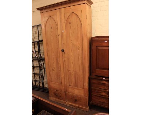 Pine fitted cupboard having two arched panel doors above two drawers
