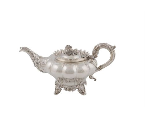 A FINE VICTORIAN SILVER TEAPOT, London 1841, mark of Benjamin Stephens, of squashed melon form, the domed hinged lid with cas