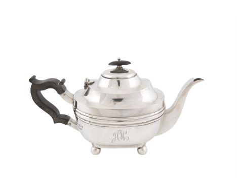 AN IRISH GEORGIAN REVIVAL SILVER TEAPOT, Dublin 1918, mark of Edmond Johnson Ltd, of oblong form, with ebon handle and finial