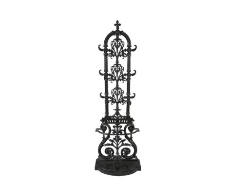 A VICTORIAN CAST IRON AND BLACK PAINTED HALL STAND, probably Coalbrookdale, of arched upright form with fleur-de-lis finial a