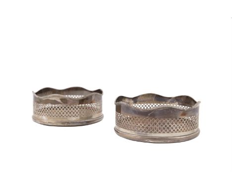 A PAIR OF CIRCULAR DECANTER COASTERS, Dublin 1973, mark of Royal Irish Ltd., with wavy gadroon boarder and pierced sides and 