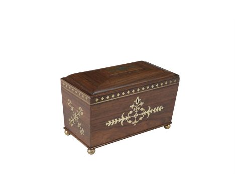 A REGENCY ROSEWOOD AND BRASS INLAID TEA CADDY, of sarcophagus form, the hinged cover engraved with initials and set with a bo