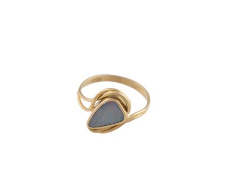 AN OPAL AND GOLD RING, the fancy-shaped opal, within a bifurcated plain hoop, mounted in 18K gold, ring size M