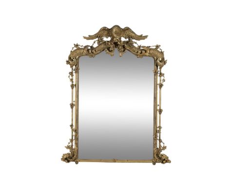 A FINE VICTORIAN GILTWOOD OVERMANTEL MIRROR, of arched rectangular form, surmounted with a carved eagle with outstretched win