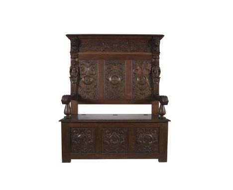 A CARVED FRUITWOOD MONK'S BENCH IN THE MANNERIST STYLE, 19th century, the shaped cornice surmounting a carved frieze flanked 