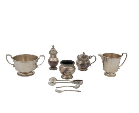 A CELTIC PATTERN THREE PIECE CONDIMENT SET, Birmingham marks, comprising baluster mustard pot, with blue glass liner and spoo