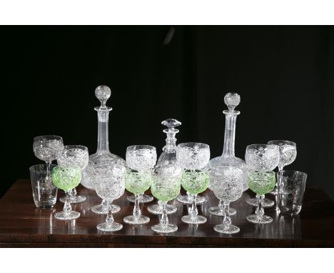 A LARGE COLLECTION OF FINE CUT GLASS including; a pair of bulbous decanters, six large red wine glasses, seven smaller exampl