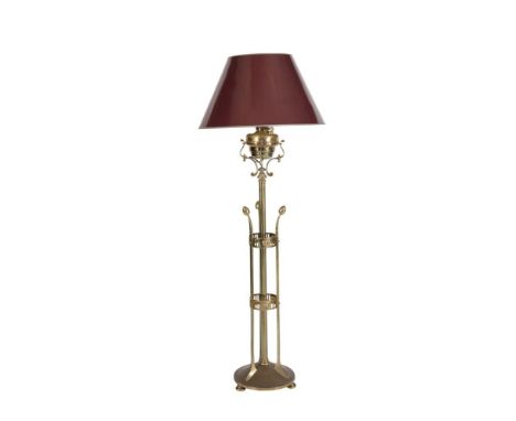 A BRASS STANDARD LAMP, c.1900, fitted with domed shade