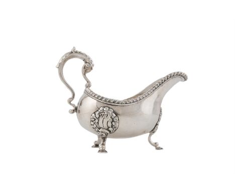 AN IRISH GEORGE III SILVER SAUCE BOAT, Dublin c.1767, mark probably that of William Homer, of solid helmet form, with thick g