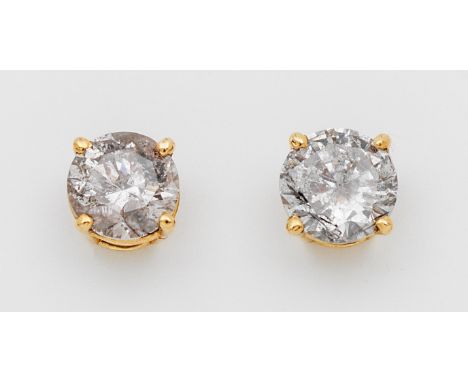 Paar klassische Brillantsolitär-Ohrstecker Gelbgold, gest. 14 k. Zentral besetzt mit je einem Brillanten von zus. ca. 0,90 ct
