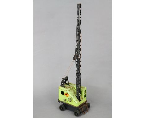 A Marx tinplate model crane; &amp; a lithographed tinplate model garage.