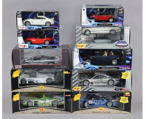 Ten various Maisto large scale die-cast model sports cars, each with window box.