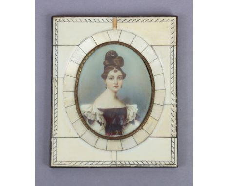 A 19th century French portrait miniature of a young lady wearing a low-cut dress, 3¼” x 2½” (oval), in an ivory frame, (frame