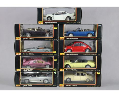 Nine Maisto large scale die-cast model motorcars, each with window box.