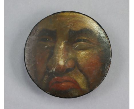 A 19th century black lacquered circular snuff box with painted portrait decoration to the lid, 4¼” diam. w.a.f.