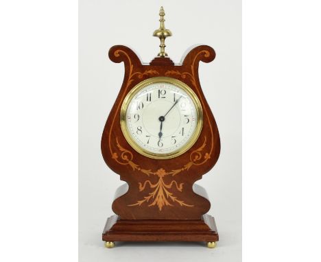 Attractive French mahogany mantel clock timepiece with platform escapement, the 3.5" convex white dial within a lyre shaped c