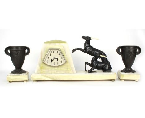 French Art Deco green and white onyx two train mantel clock garniture, the movement with outside countwheel striking on a bel
