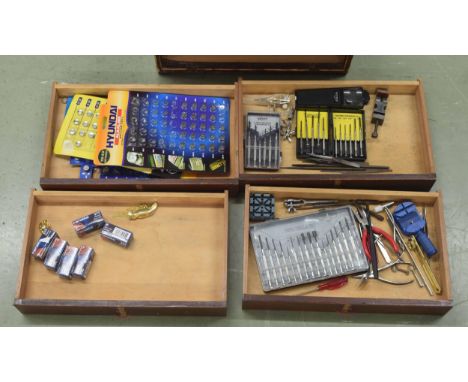 Small pine chest of four long drawers containing small watch tools including pliers, precision screw drivers, large quantity 