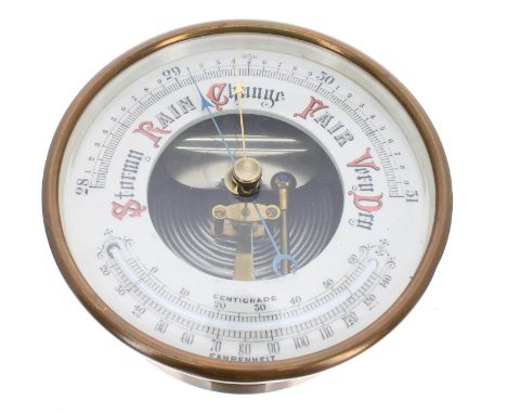 Brass drumhead aneroid barometer, 4.75" chapter ring fitted with a thermometer and enclosing an open centre 