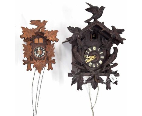 Black Forest two train cuckoo clock, the 4.75" dial within a chalet case applied with carved birds and foliage, 19" high (pen