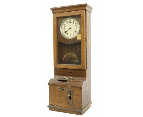 International Time Recording Co. Limited of London time recorder, within an oak glazed case, 39.75" high 