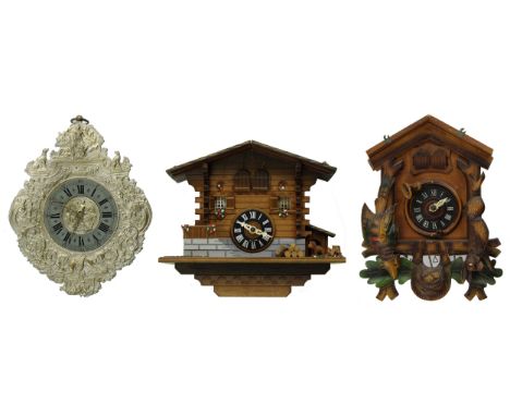 Contemporary German two train wall clock, the 7" silvered dial within a metal surround repousse with hunting scenes, the wood