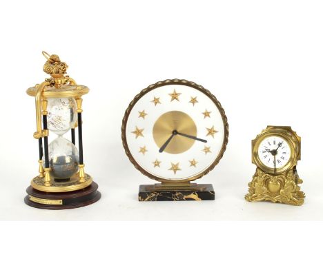 Bayard eight day mantel mystery clock, the 6.5" glass dial with star batons supported upon a rectangular black marble base, 8