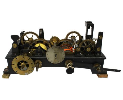 Good rare small two train flatbed turret clock, the 4.25" silvered dial plate signed E.J. Vokes, Bath, within a cast iron fra