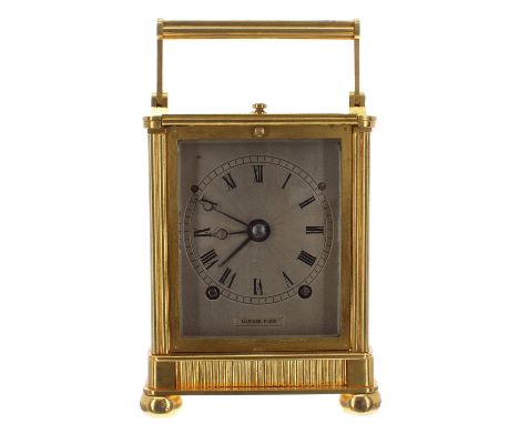 Good French ormolu carriage clock striking on a gong, the silvered engine turned dial signed Garnier Paris and stamped no. 31