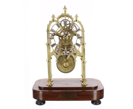 Brass single fusee skeleton clock, the 4.25" silvered pierced chapter ring and movement upon four flat supports terminating i