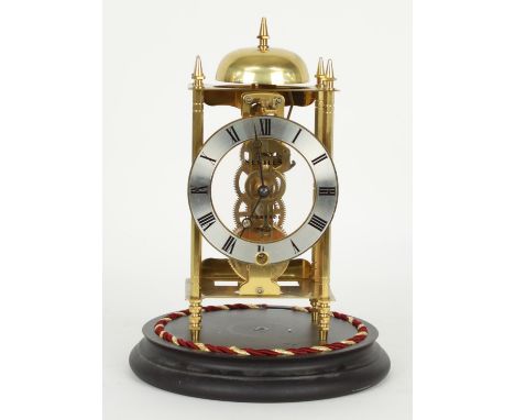 Contemporary Sewills of Liverpool brass mantel clock timepiece striking on a bell, under a glass dome and upon a stepped ebon