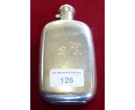 A silver hip flask by James Dixon of Sheffield 1895 of arched form, with presentation initials. 14cm 4oz