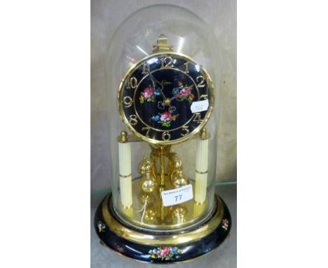 A Kein Clock under glass dome.