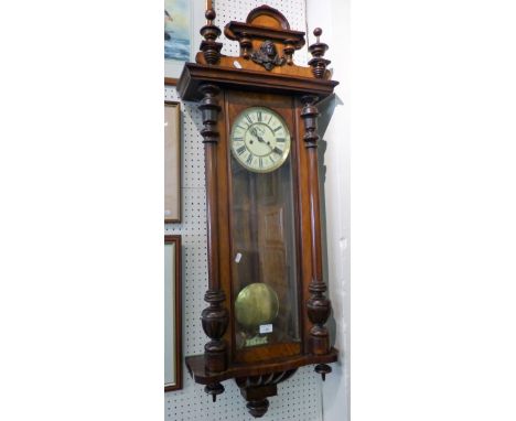 A Victorian mahogany Vienna style wall clock, with two part dial, striking on a gong, pendulum, 120cm.