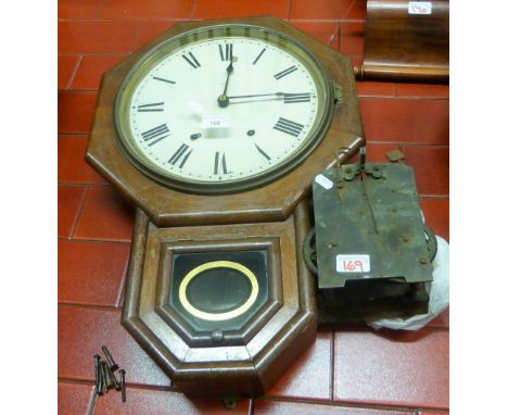 Seth Thomas, Conn USA, an octagonal drop dial wall clock, the white enamel dial with Roman numerals, pendulum, together with 