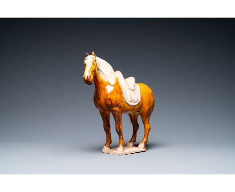 Full title: A Chinese amber- and cream-glazed pottery model of a horse, TangDescription:L.: 34,5 cm - H.: 33 cmÊ Provenance: 