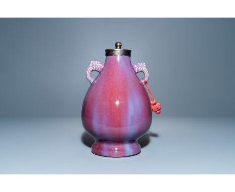 Full title: A Chinese lamp-mounted flambe-glazed vase, QianlongDescription:H.: 34,5 cmThe absence of a condition report does 